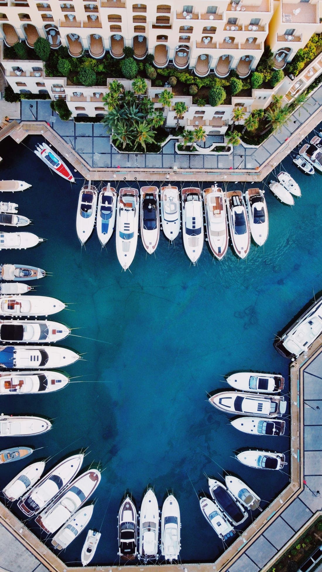 Pleasure boats and yachts moored at a Maltese marina waiting for routine hull cleaning